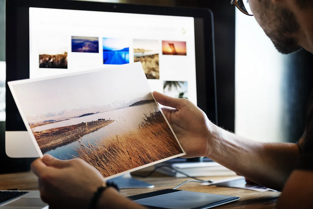 A creator organizing visual content in a studio